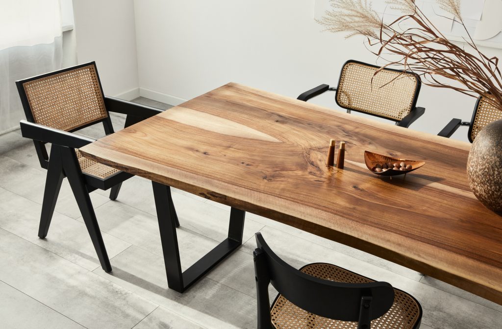 Custom dinning table created by wood in dinning room of house