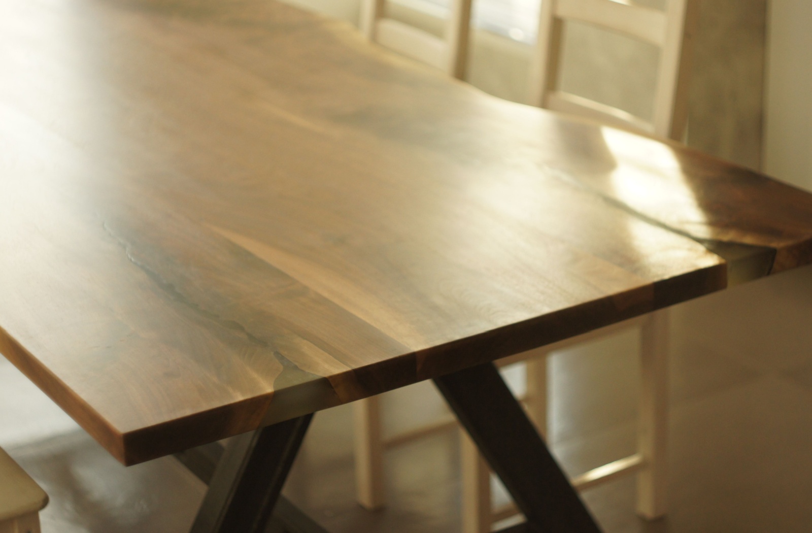 A solid wood dining room table.