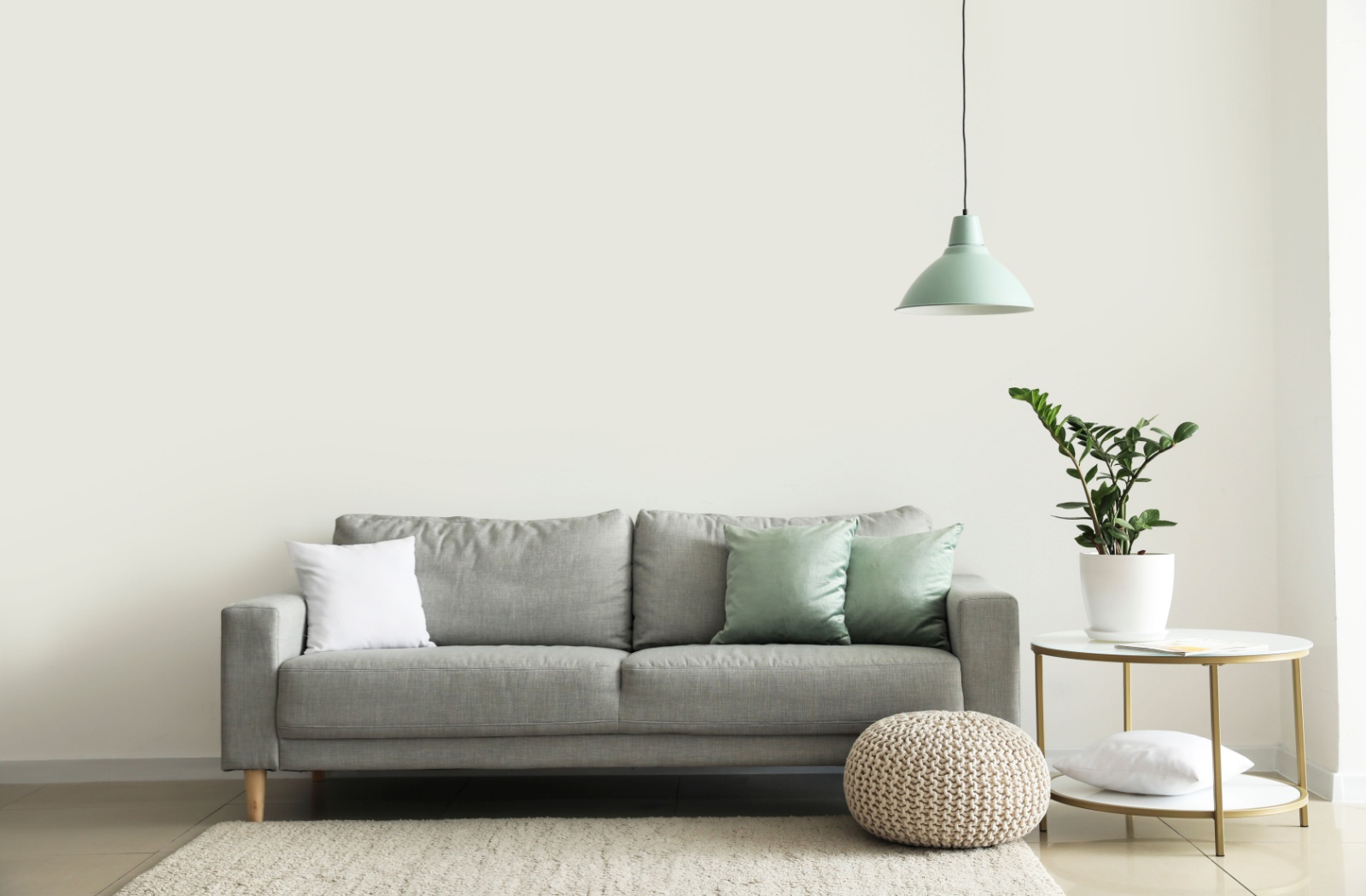 Modern Canadian-made sofa in a brightly lit living room.